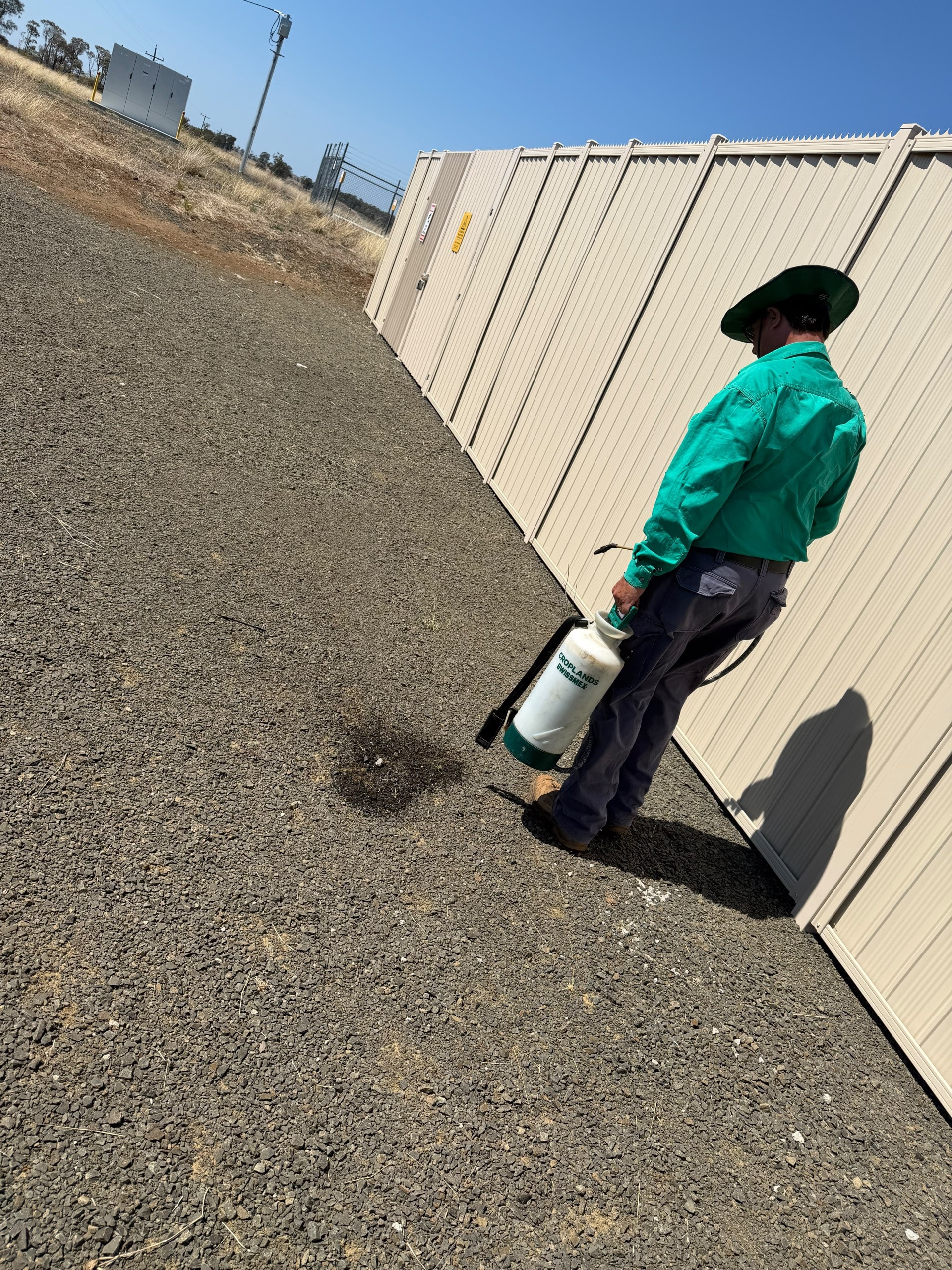 Commercial weed control operator with sprayer